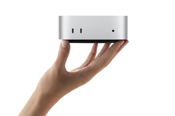 Silver Mac mini held in a hand